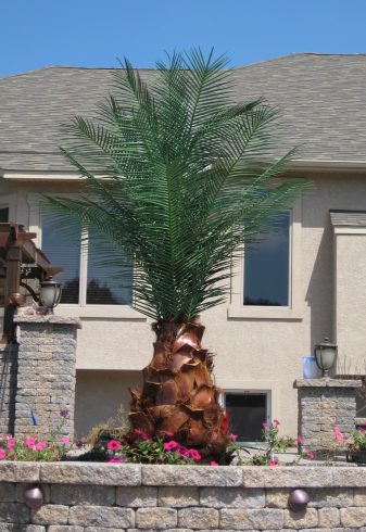Fake outdoor palm tree at a residential property