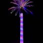 Glowing red, white, and blue 4th of July lighted outdoor artificial palm tree at dusk